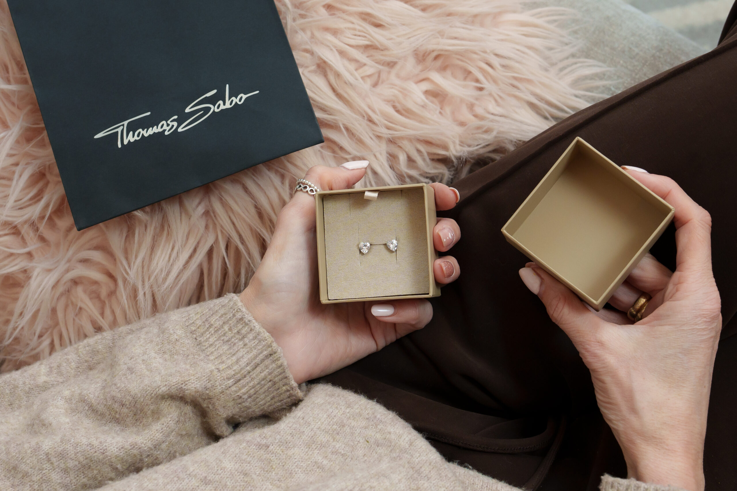 Heart-shaped earrings in a gift box for a thoughtful Mother’s Day present