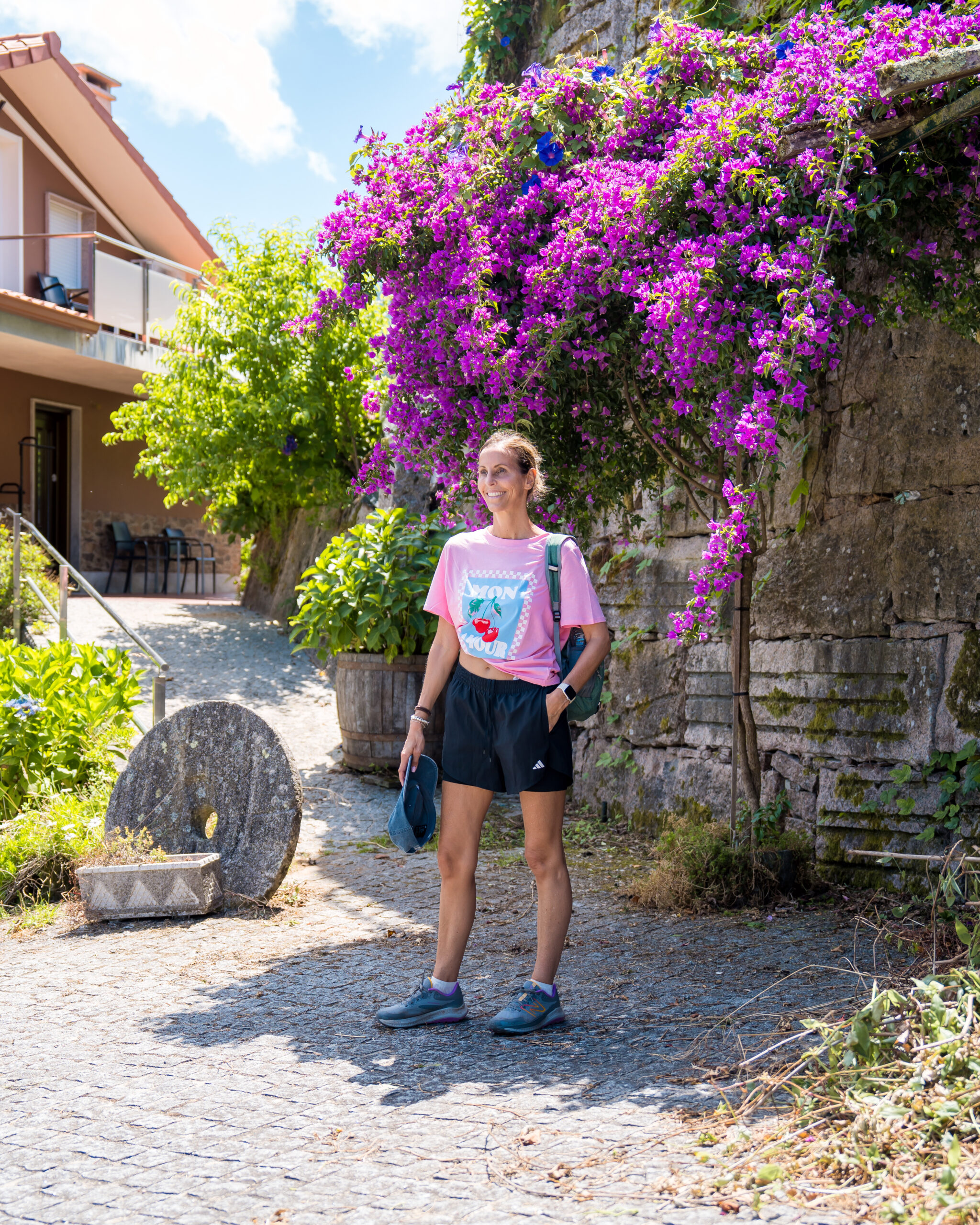 Woman standing with flowers on Camino Portuguese